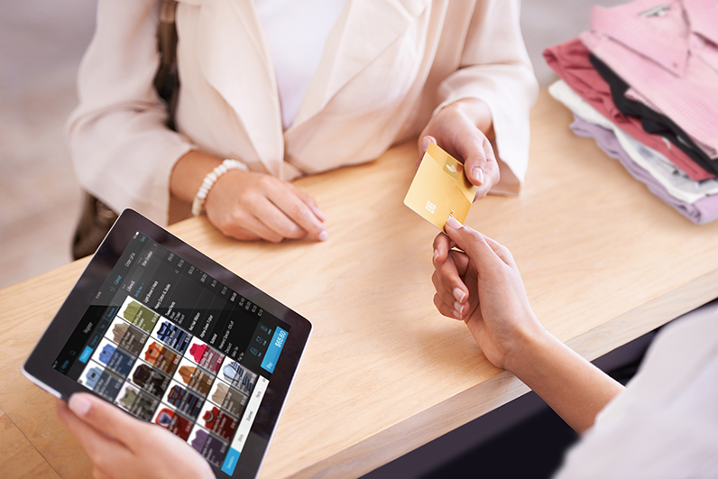 Woman paying with credit card