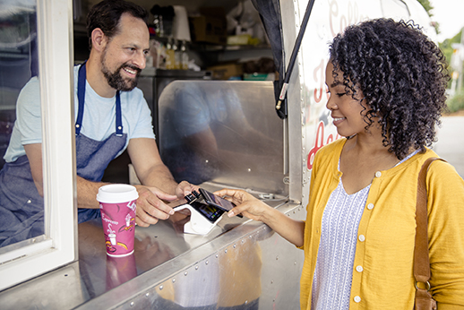 People paying at food truck