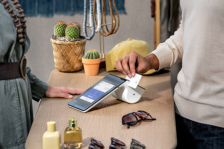 paying with a credit card in a clothing shop